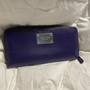 Michael Kors purple leather wallet.